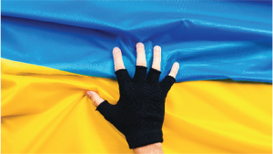 Ukrainian Flag with gloved hand