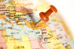 Red pin on a global with close-up of Turkey